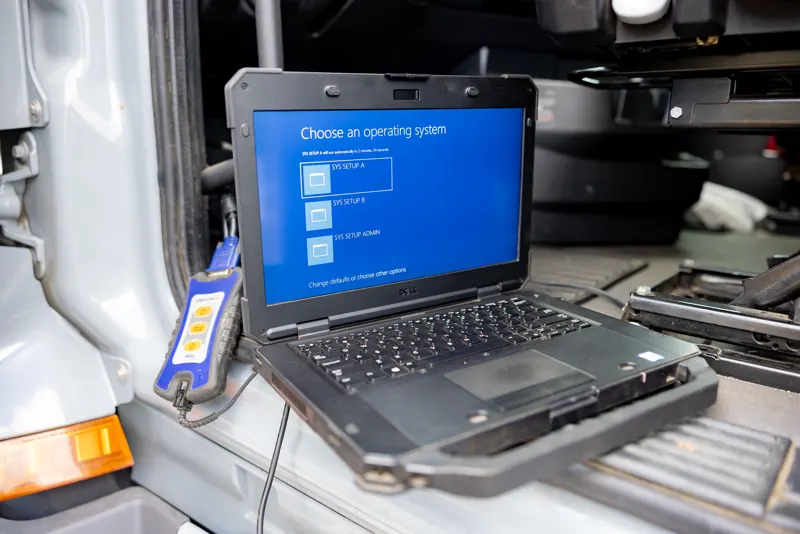 Diagnostic laptop hooked to a semi truck